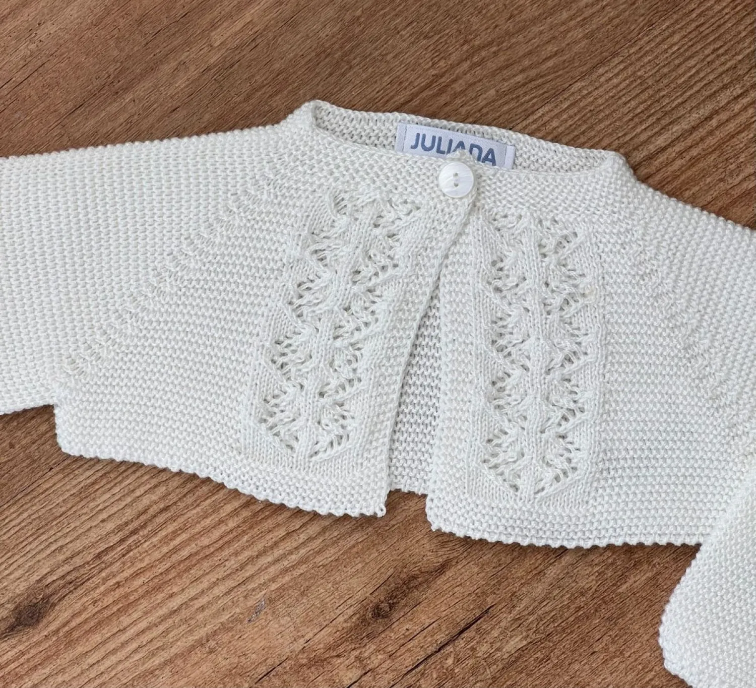 Short beige christening jacket. Unisex